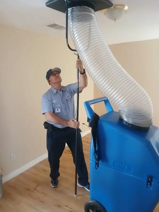 Furnace Tune-Up technician using HEPA equipment in Roeland Park